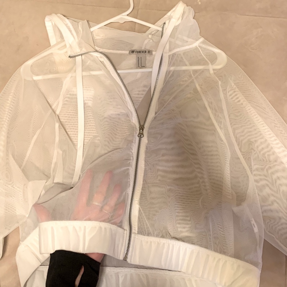 Mesh white crop worn as sweatshirt/ athletic/ concert attire